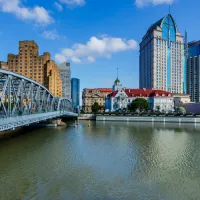 City skyline and bridge across a river