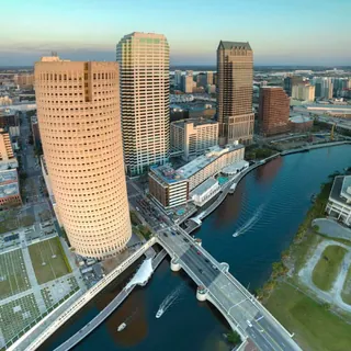 Aerial view of a city skyline beside a river